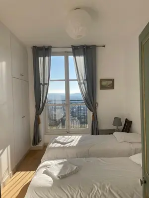 Un ou plusieurs lits dans un hébergement de l'établissement Appartement dans château