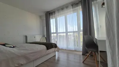 Un ou plusieurs lits dans un hébergement de l'établissement Appartement Clara Parking Gratuit