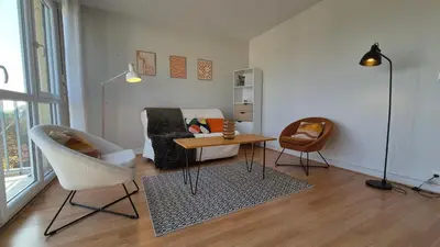 Coin salon dans l'établissement Appartement Clara Parking Gratuit