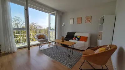 Coin salon dans l'établissement Appartement Clara Parking Gratuit