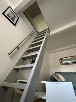 Un ou plusieurs lits superposés dans un hébergement de l'établissement Studio avec mezzanine Paris 30 min Wi-Fi rapide