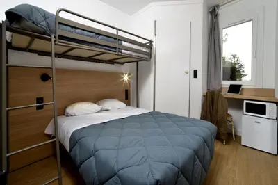 Un ou plusieurs lits dans un hébergement de l'établissement HOTEL PREMIERE CLASSE Rouen Sud Oissel