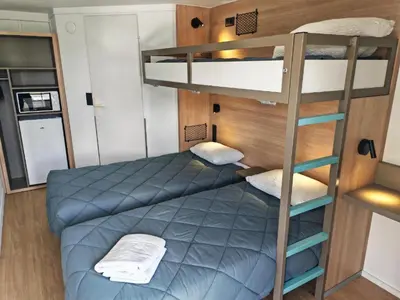 Un ou plusieurs lits dans un hébergement de l'établissement HOTEL PREMIERE CLASSE Rouen Sud Oissel