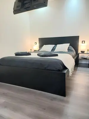 Un ou plusieurs lits dans un hébergement de l'établissement Le Quantum Room - Avec Netflix et Amazon Prime