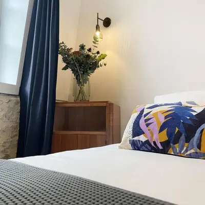 Un ou plusieurs lits dans un hébergement de l'établissement Maison l'Héritage by La Boîte en Plus