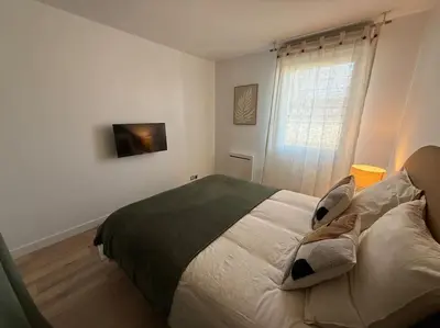 Un ou plusieurs lits dans un hébergement de l'établissement Appartement Cosy Cergy Le Haut Gare