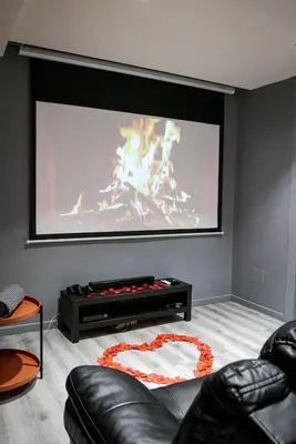 Coin salon dans l'établissement Suite CinéRoom à 25 min de Paris