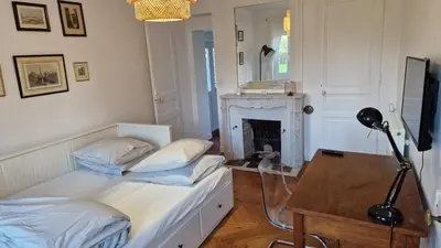 Télévision ou salle de divertissement dans l'établissement Gite dans une maison normande