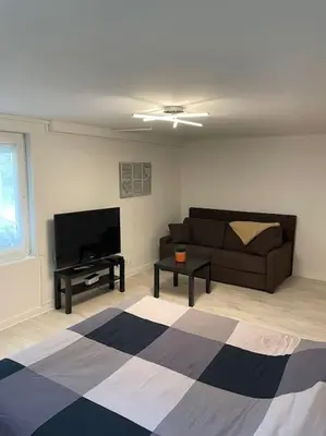 Télévision ou salle de divertissement dans l'établissement Appartement terrasse avec vue et parking privé
