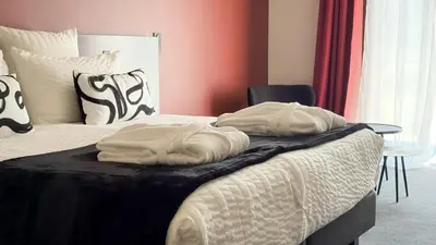 Un ou plusieurs lits dans un hébergement de l'établissement Les Lodges de Socrate