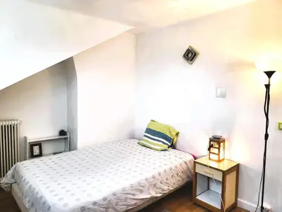 Un ou plusieurs lits dans un hébergement de l'établissement Appartement de 60m2 à 20 minutes de Paris