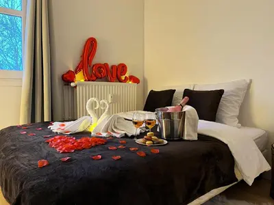 Un ou plusieurs lits dans un hébergement de l'établissement L'Escapade Romantique