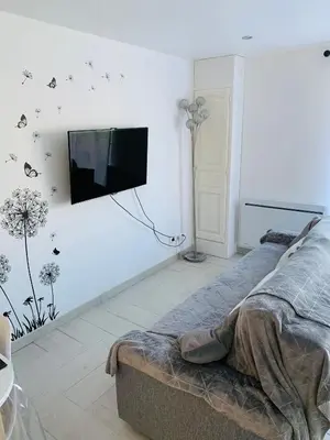 Télévision ou salle de divertissement dans l'établissement Le Loft