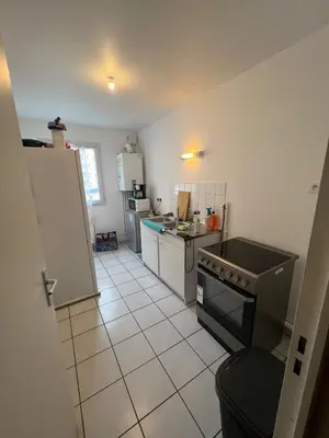 Cuisine ou kitchenette dans l'établissement Appartement chaleureux