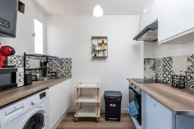 Cuisine ou kitchenette dans l'établissement Le Saint Clément C