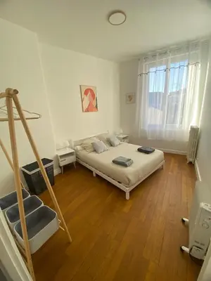 Un ou plusieurs lits dans un hébergement de l'établissement Coeur de ville - Appartement 2 chambres