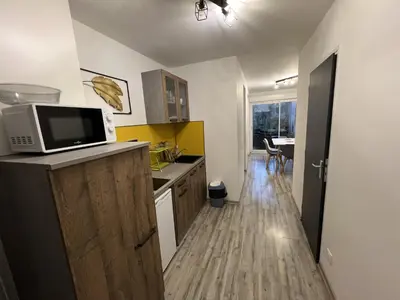 Cuisine ou kitchenette dans l'établissement Cote Jardin, AMIENS 4-6 P