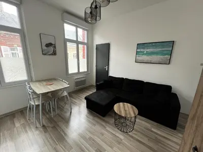 Coin salon dans l'établissement Amiens, appart douillet 2-4P