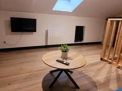 Télévision ou salle de divertissement dans l'établissement Les Capucins