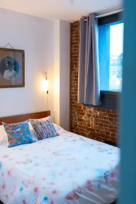 Un ou plusieurs lits dans un hébergement de l'établissement La Maison Bleue, terrasses et vue panoramique mer