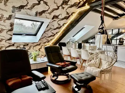 Coin salon dans l'établissement Appartement dans la Résidence le Chateaux