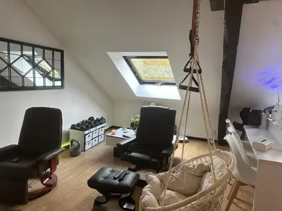 Coin salon dans l'établissement Appartement dans la Résidence le Chateaux