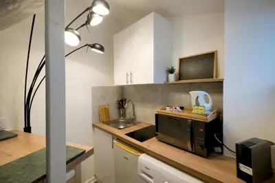 Cuisine ou kitchenette dans l'établissement Le Nid - Studio in Hypercentre - Cathédrale