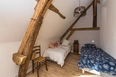 Un ou plusieurs lits dans un hébergement de l'établissement Grand Gîte des Hautes Maisons