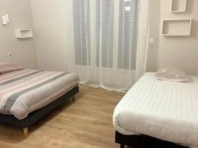 Un ou plusieurs lits dans un hébergement de l'établissement Appart F2 spacieux proche Paris