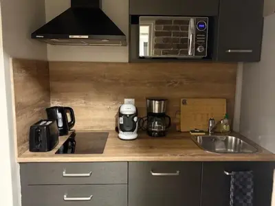 Cuisine ou kitchenette dans l'établissement Appart F2 spacieux proche Paris