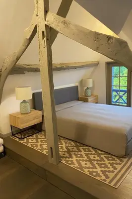Un ou plusieurs lits dans un hébergement de l'établissement 1h10 de Paris, maison de campagne avec piscine chauffée et Jacuzzi