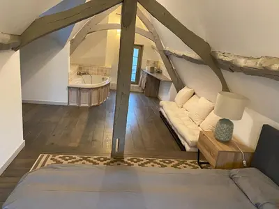 Coin salon dans l'établissement 1h10 de Paris, maison de campagne avec piscine chauffée et Jacuzzi