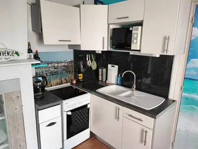 Cuisine ou kitchenette dans l'établissement Appartement Cosy entre port et plage