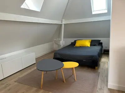 Un ou plusieurs lits dans un hébergement de l'établissement Appart hôtel Doumer