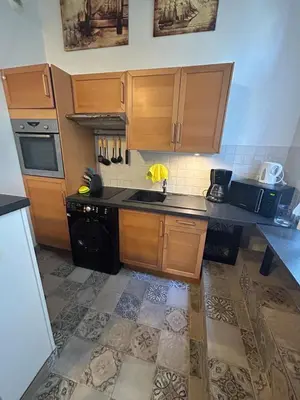 Cuisine ou kitchenette dans l'établissement L'escapade en mezzanine