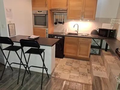 Cuisine ou kitchenette dans l'établissement L'escapade en mezzanine