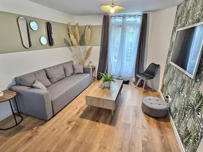 Coin salon dans l'établissement Maisonette Cozy, Neuf, Centre-ville, Wifi