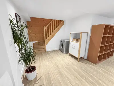 Cuisine ou kitchenette dans l'établissement Maison cosy rénovée et lumineuse