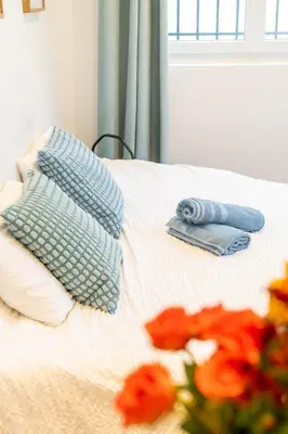 Un ou plusieurs lits dans un hébergement de l'établissement Chez Marie Splendide Studio Cormeilles en Parisis