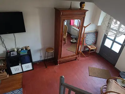 Télévision ou salle de divertissement dans l'établissement Cozy house