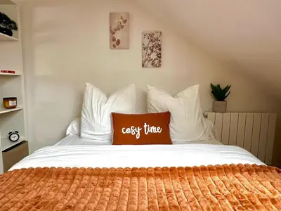 Un ou plusieurs lits dans un hébergement de l'établissement Appartement Cosy avec Netflix et parking gratuit