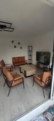 Coin salon dans l'établissement Maison avec vue sur mer