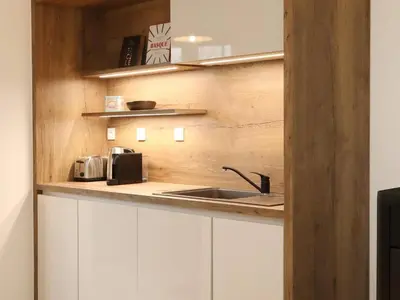 Cuisine ou kitchenette dans l'établissement La Maison Aux Fleurs by La Boîte En Plus