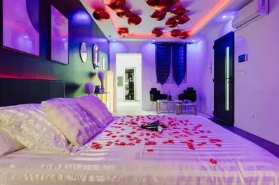 Un ou plusieurs lits dans un hébergement de l'établissement La cachette romantique