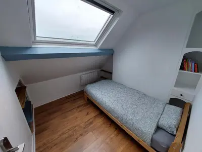 Un ou plusieurs lits dans un hébergement de l'établissement Charmant Duplex au coeur de Dieppe