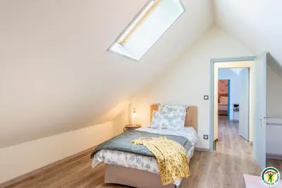 Un ou plusieurs lits dans un hébergement de l'établissement Miel et groseilles