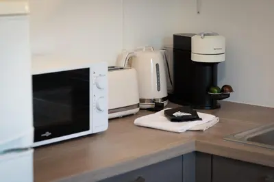 Cuisine ou kitchenette dans l'établissement Le Nicole un appartement en duplex avec balcon et place de parking