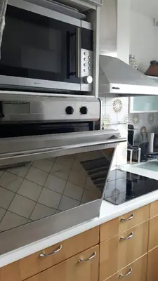 Cuisine ou kitchenette dans l'établissement Appartement lumineux à 20mn de Paris en RER A