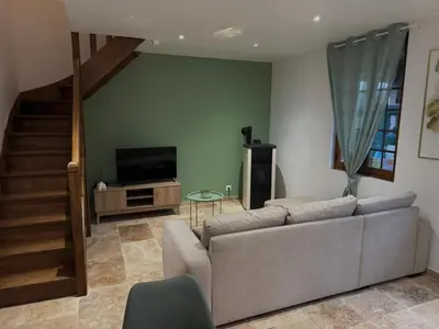 Télévision ou salle de divertissement dans l'établissement Maison Normande bord de rivière