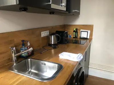 Cuisine ou kitchenette dans l'établissement Jardin Abbatiale